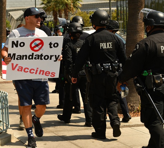 Dueling vaccine demonstrations result in violence