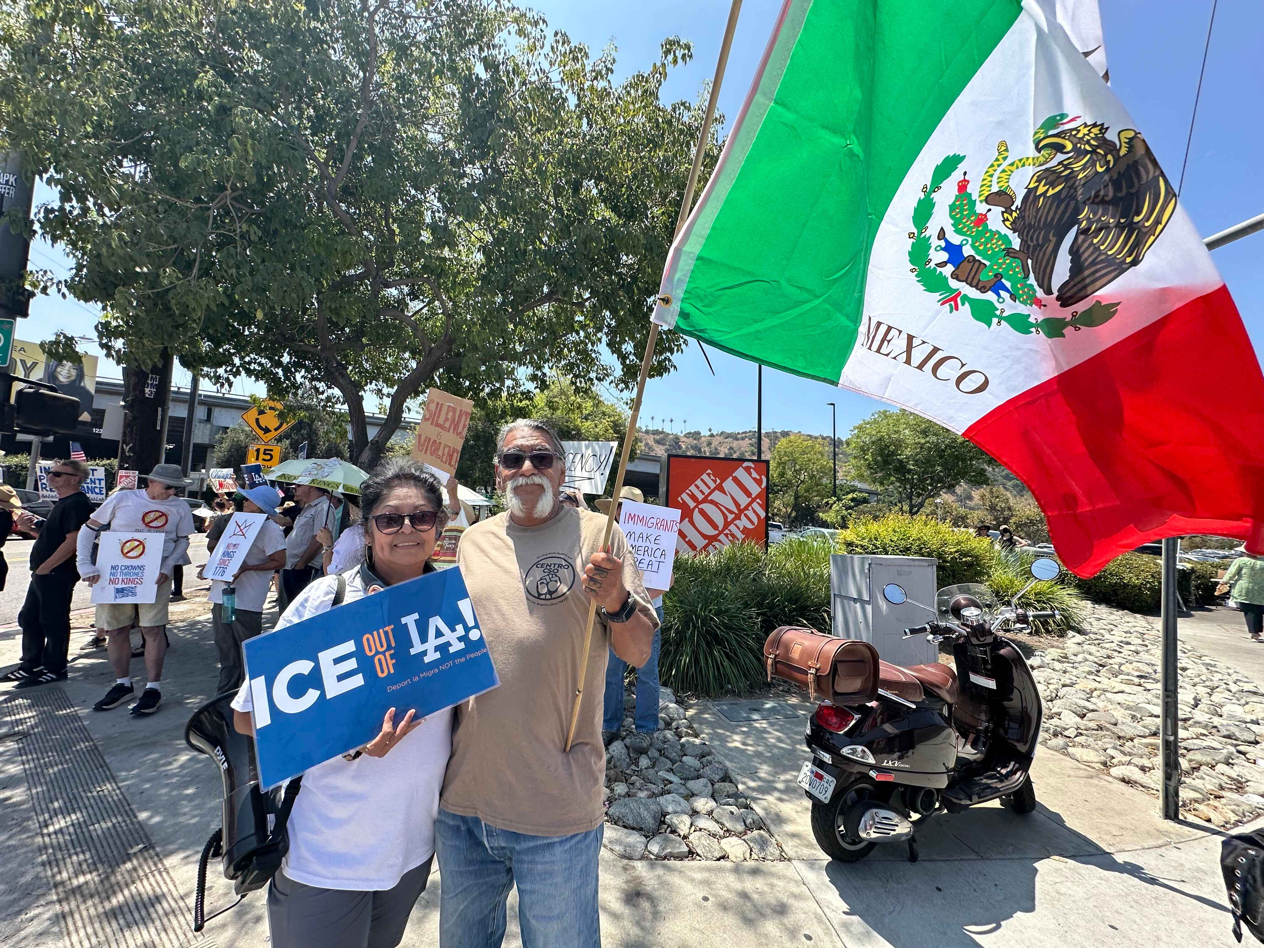 Immigration rights advocates gather outside a Home Depot in Cypress Park protesting federal immigration agents.
