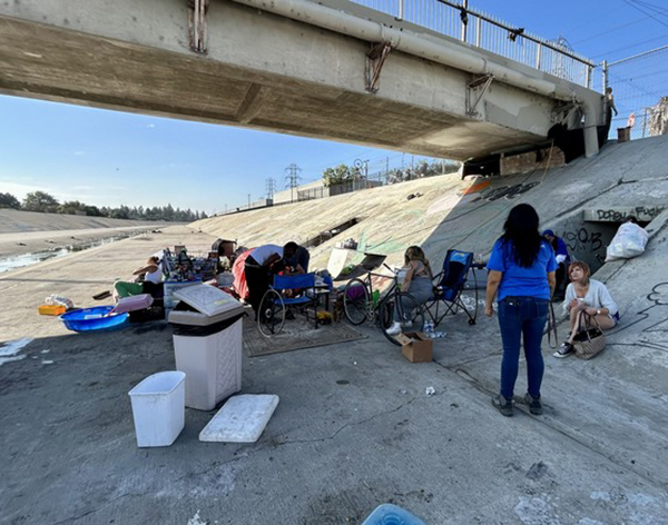 County houses 40 people living under 105 Freeway